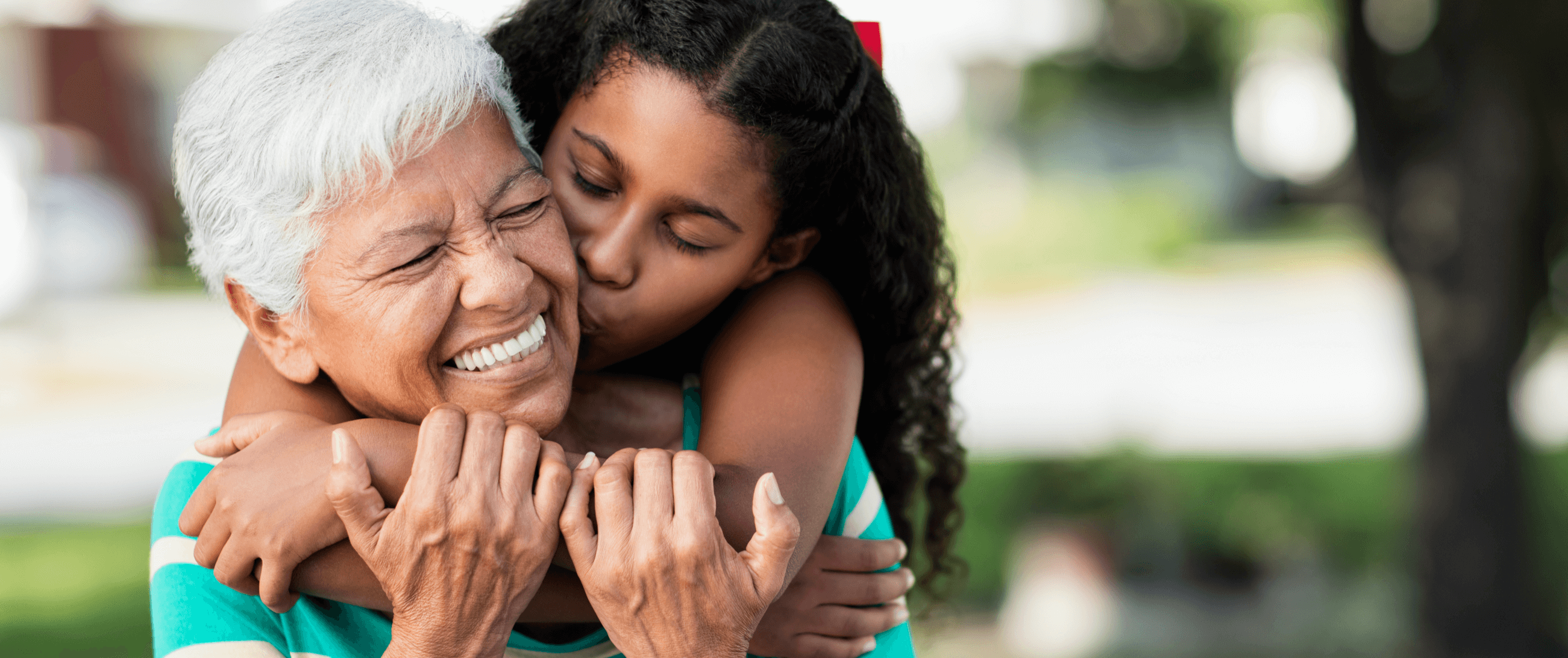 grandma and granddaughter hugging