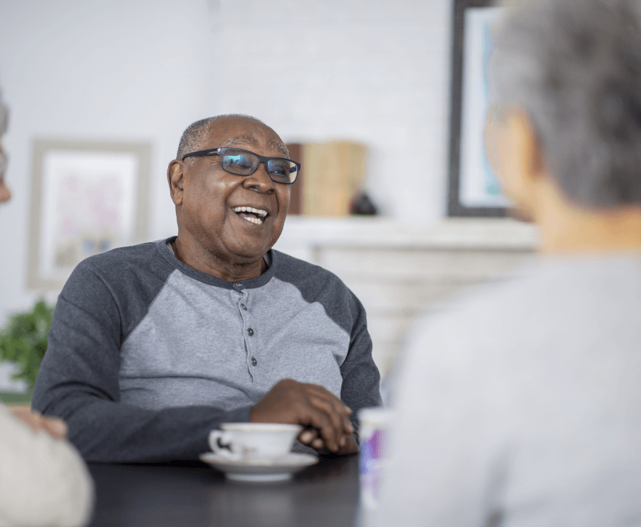 senior men chatting with tea