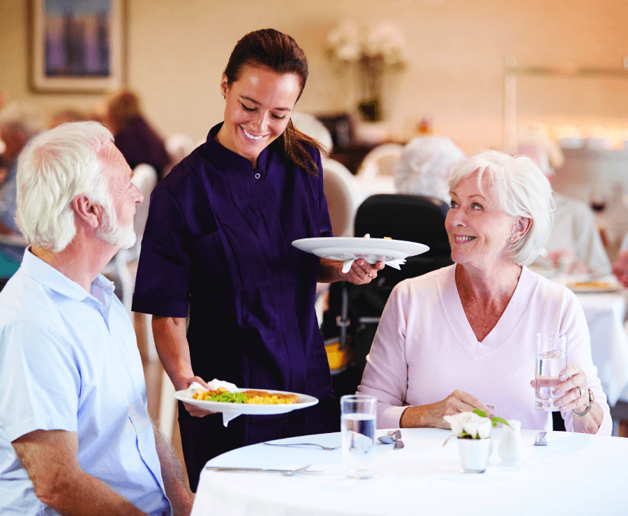 server serving food to seniors